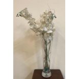 A heavy bottomed clear glass vase with faux flowers (H60cm)