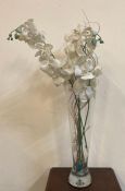 A heavy bottomed clear glass vase with faux flowers (H60cm)