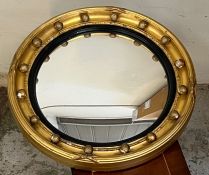 A Regency convex gilt wood wall mirror