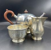 A Three piece silver tea service comprising teapot, sugar bowl and milk jug by Blackmore &