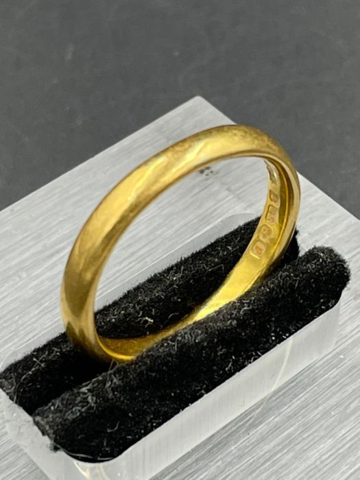 A 22ct gold wedding band (Approximate Total Weight 5.2g) Size R