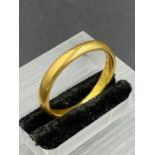 A 22ct gold wedding band (Approximate Total Weight 5.2g) Size R