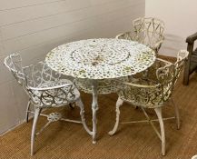 A white painted metal garden table and three chairs