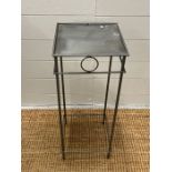 A small metal side table