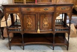 A mahogany break front sideboard with marquetry to front with double doors flanked either side by