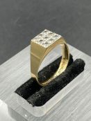 A Gents signet ring with white stones marked 10k (Approximate Total Weight 2.7g)