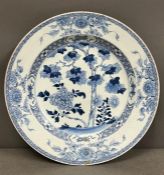 Chinese blue and white charger dish, cobalt blue and white foliage pattern and scrolling rim (