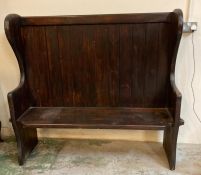 A stained pine Art and Craft style bench or settle