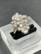 An 18ct gold diamond ring Size M