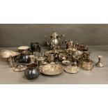 A quantity of silver plate items to include coffe pot, milk jugs and candle sticks