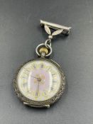 A silver ladies pocket watch