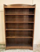 A Mid Century four shelf oak bookcase (H195cm W121cm D33cm)AF