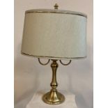 A brass two armed table lamp