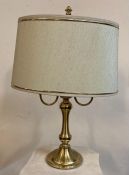 A brass two armed table lamp