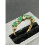 A four stone jade and diamond ring Size L