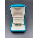 A pair of 18ct emerald and diamond earrings