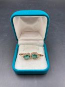 A pair of 18ct emerald and diamond earrings