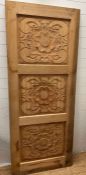 A wooden carved panel decorated with Tudor rose style flowers