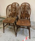 Four oak vintage wheel back dining chairs