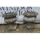 A pair of gadrooned garden urns (38cm x 40cm)