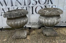 A pair of gadrooned garden urns (38cm x 40cm)