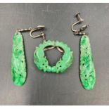 A Jade brooch and earring set.