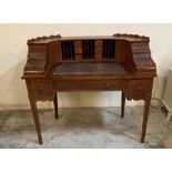 An Edwardian carlton house desk with brown leather top