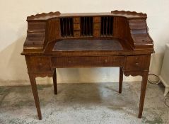 An Edwardian carlton house desk with brown leather top