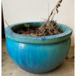 A turquoise glazed garden planters