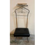 A Mid Century gentleman valet with black leather cushion