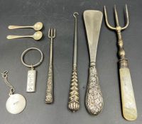 A selection of silver curios, to include button hook, shoehorn , key ring, salts spoons etc