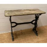 A reclaimed cast iron garden table with wooden top