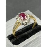 An 18ct gold ruby and diamond ring 0.33ct in total (Approximate Total Weight 4.2g) Size T1/2