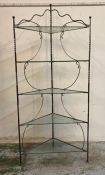 A wrought iron corner unit consisting of five glass shelves (H170cm)