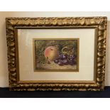 A still life, watercolour, Peach and Grapes in ornate frame, indistinct signature bottom left.(