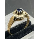 A 9ct gold diamond and sapphire ring (Approximate Total weight 2.8g)