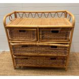 A bamboo and cane two over two chest of drawers (H81cm W80cm D319cm)