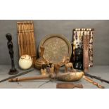 A selection of African items to include spear heads, musical instruments and a painted ostrich egg