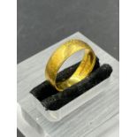 A 22ct gold wedding band (Approximate Total Weight 4.8g)