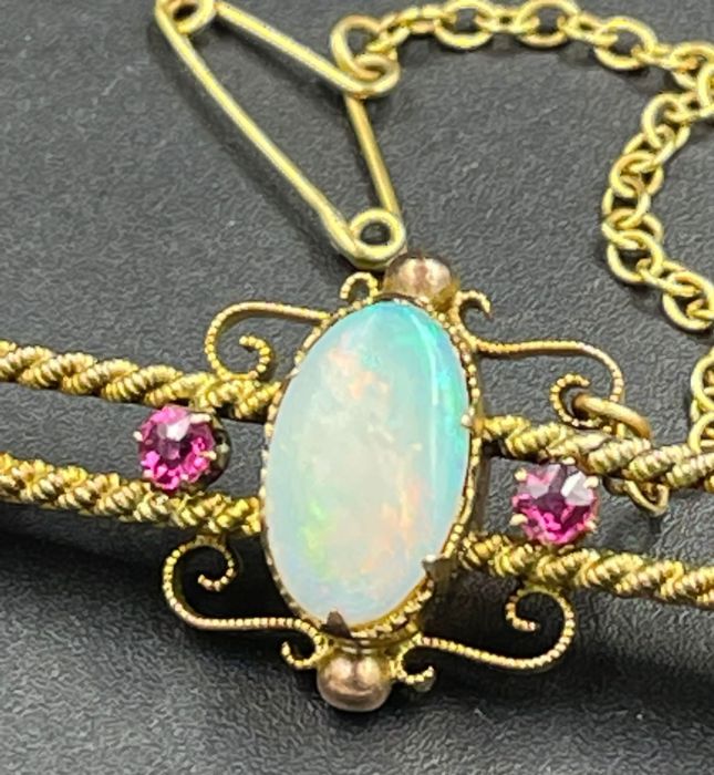 An Opal and ruby brooch in a gold setting AF - Image 3 of 5