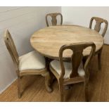 A rustic frame house style dining table with four chairs