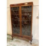 A mahogany five shelf glazed bookcase on claw and ball feet (H180cm W100cm D34cm)