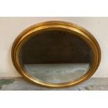 A wooden gold painted hall mirror 72cm x 62cm