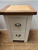 A small square side table consisting of two drawers