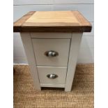 A small square side table consisting of two drawers