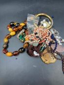 A selection of amber, jade and coral and some costume jewellery