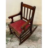 A child's mahogany rocking chair