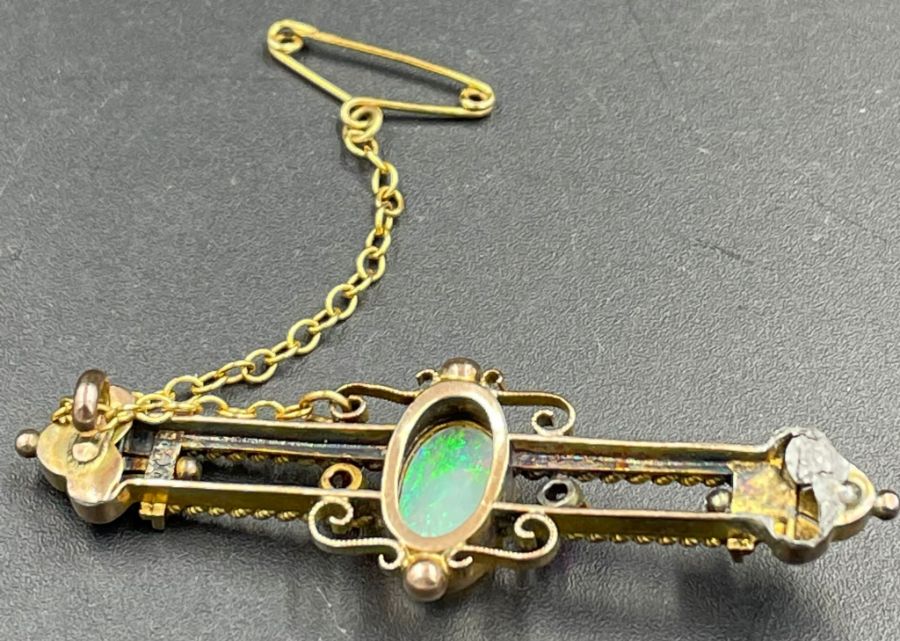 An Opal and ruby brooch in a gold setting AF - Image 2 of 5
