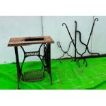 A collection of iron manager Singer sewing machine stand