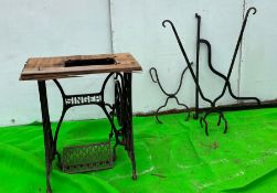 A collection of iron manager Singer sewing machine stand